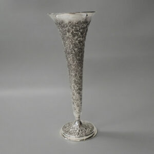 Trumpet shaped vase repousse flowers style
